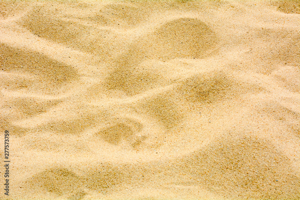 closeup of sand pattern of a beach in the summer closeup of sand pattern of a beach in the summer