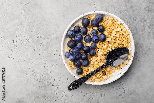 Healthy balanced breakfast. Whole grain caramel granola, fresh organic blueberries. Minimalism.
