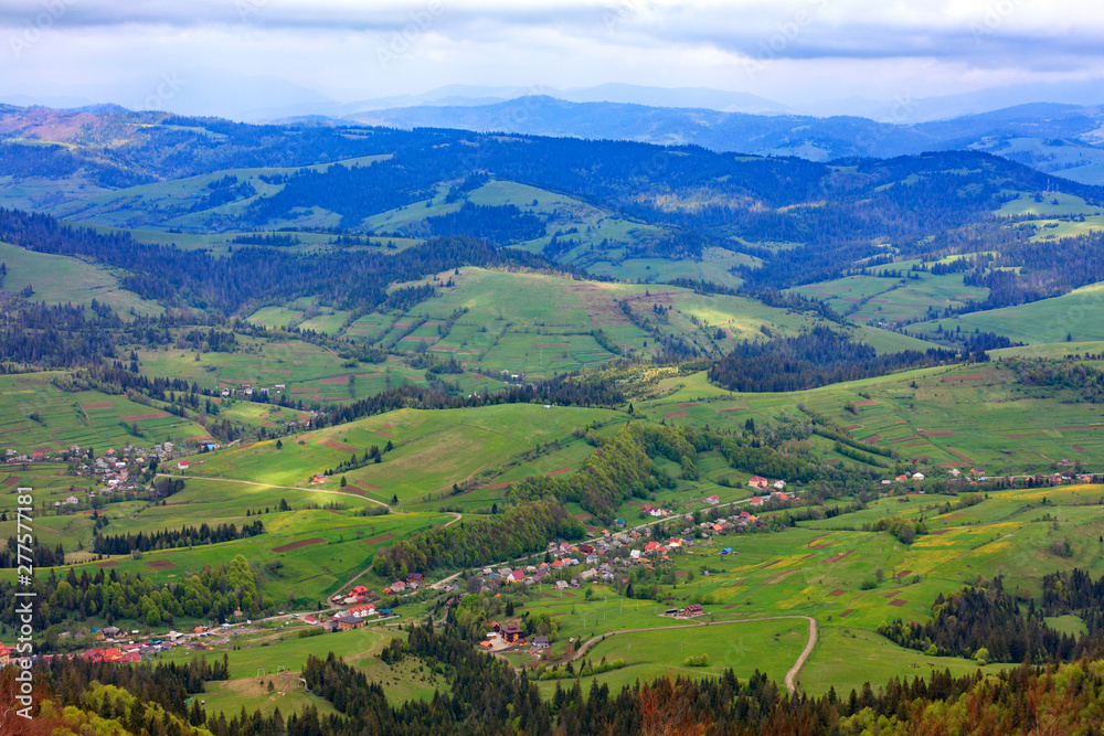 Beautiful landscape of the Carpathian mountains, Ukraine. View of the village from the top of the mountain.