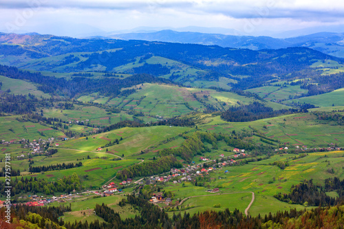 Fototapeta Naklejka Na Ścianę i Meble -  Beautiful landscape of the Carpathian mountains, Ukraine. View of the village from the top of the mountain.