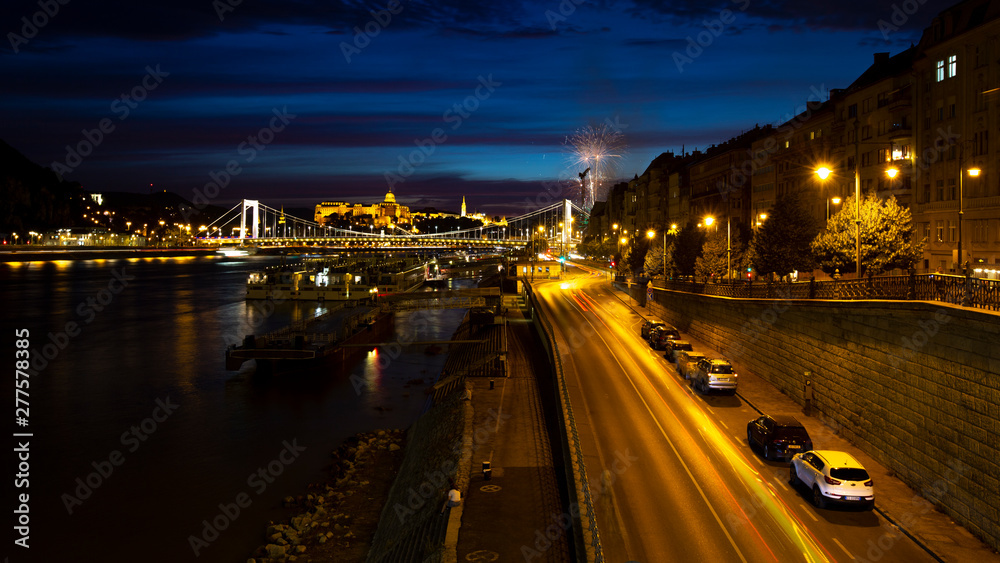 View from Liberty Bridge on the night Danube, Erzhebet Bridge. Fireworks in the night sky