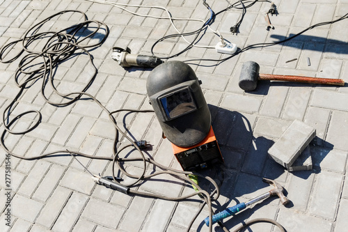 Welding machine and mask with tools.