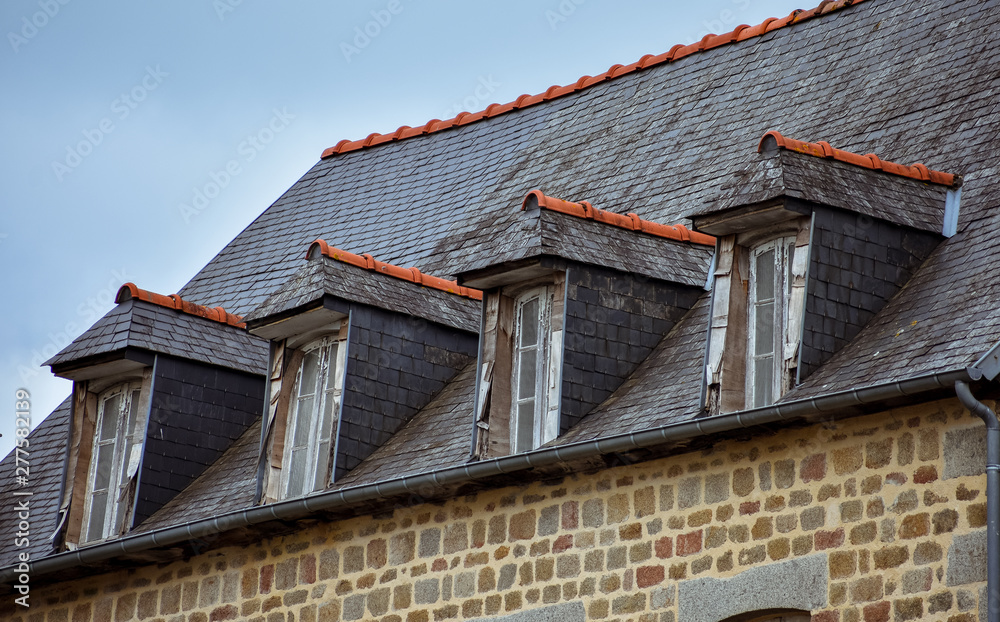 Slate roof and dormer windows in typical houses of French Brittany. Slate roof and dormer windows in typical houses of French Brittany.