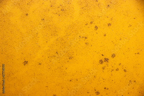 Yellow grunge painted wall texture