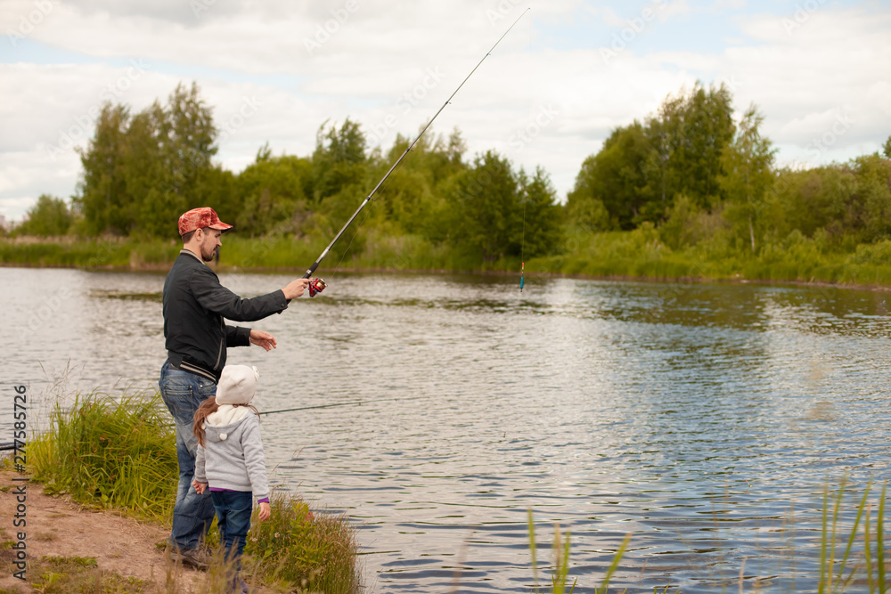 Dad and daughter fishing on lake Dad and daughter fishing on lake