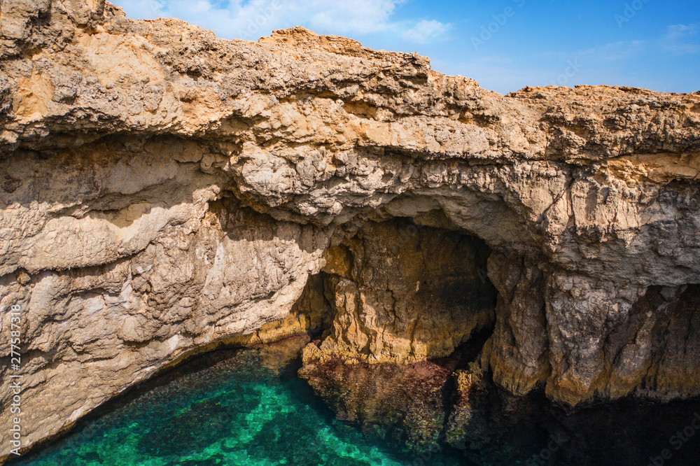 Big natural hole in the rock. Coral Lagoon. Mellieha. Maltese nature