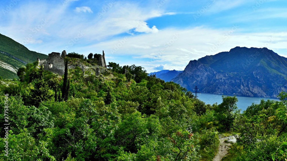Italy-view of the ruins of the castle Penede and lake Garda