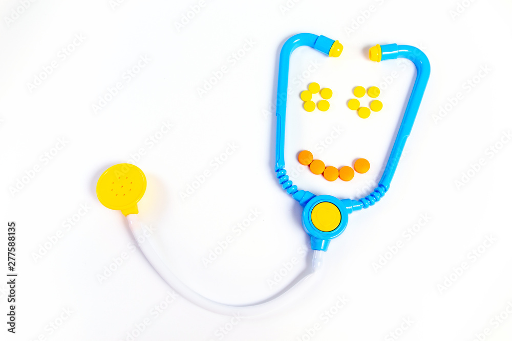 Blue stethoscope Isolated on white background. Medicine concept. Children's toys by profession doctor. Stethoscope smiles.