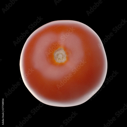 Tomato isolated on black. Without leaves. Top view. Close up.