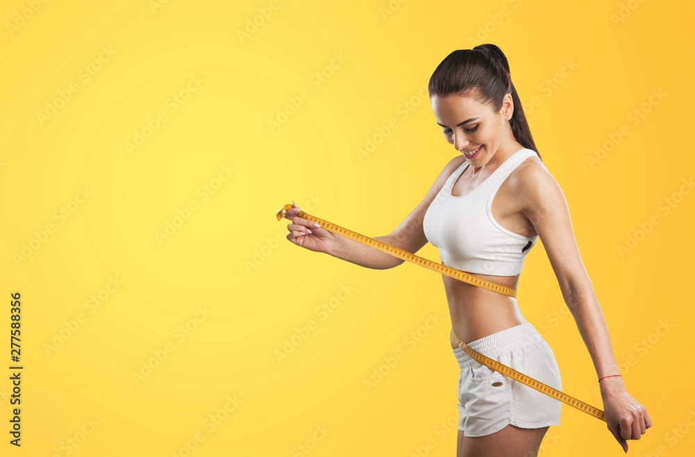 Woman and tape measure. - obrazy, fototapety, plakaty 