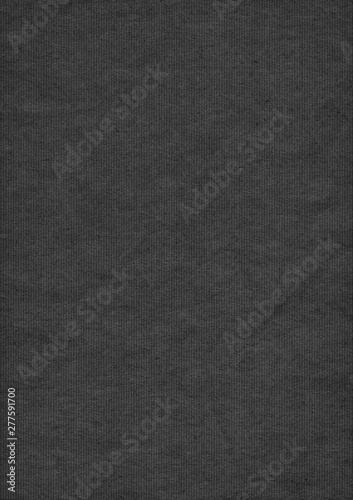 Photograph of recycle black Kraft striped paper coarse grain crumpled grunge texture sample 