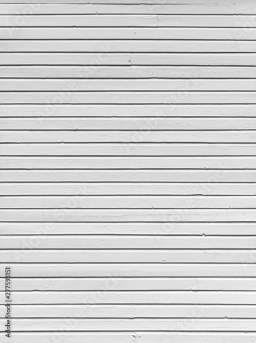 Clean wood board wall painted in white, textured background in black and white.