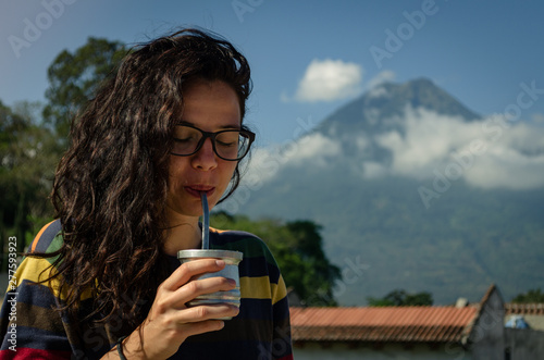 Brunette girl drinking mate