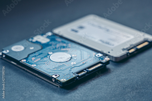 SSD drive and 2.5 HDD drive. Solid State Drive vs traditional HDD, isolated. Fast storage device vs slow.