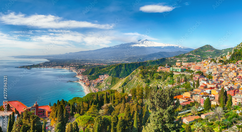 Aquamarine blue waters of sea near Taormina resorts and Etna volcano mount