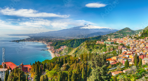 Aquamarine blue waters of sea near Taormina resorts and Etna volcano mount