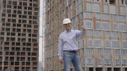 Wallpaper Mural A successful builder engineer in a white helmet 4K Torontodigital.ca