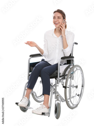 Young woman in wheelchair talking on mobile phone, white background