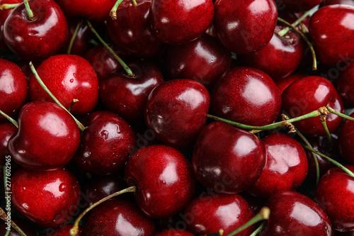 Delicious ripe sweet cherries as background, top view