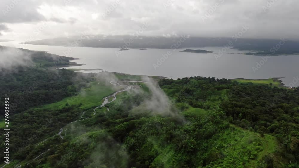 Aerial Drone Flying around lake lagoon near Arenal Volcano, Costa Rica Aerial Drone Flying around lake lagoon near Arenal Volcano, Costa Rica