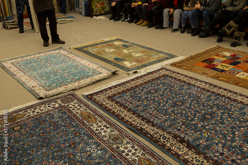 The carpets on the background in the shop for special costumers from Nevsehir, Sivas and other Turkish city in Turkey.