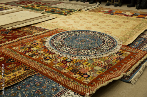 The carpets on the background in the shop for special costumers from Nevsehir, Sivas and other Turkish city in Turkey.