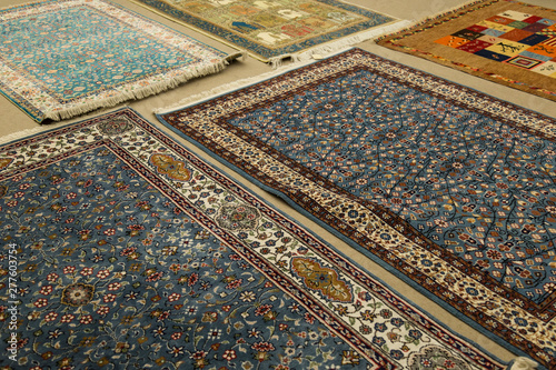 The carpets on the background in the shop for special costumers from Nevsehir, Sivas and other Turkish city in Turkey.