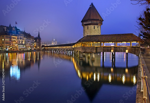 The famous Kapellbrücke (literally "Chapel Bridge"), the most famous landmark of Lucerne city, Switzerland. You can also see the Wasserturm (literally "Water Tower"). © Iraklis Milas