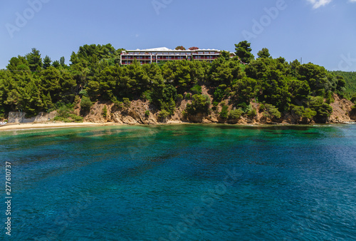 Landscape view to Skiathos island from the sea. Old bildings of town. Greece