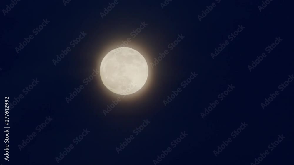 Full moon in the night sky. Close-up shot Full moon in the night sky. Close-up shot
