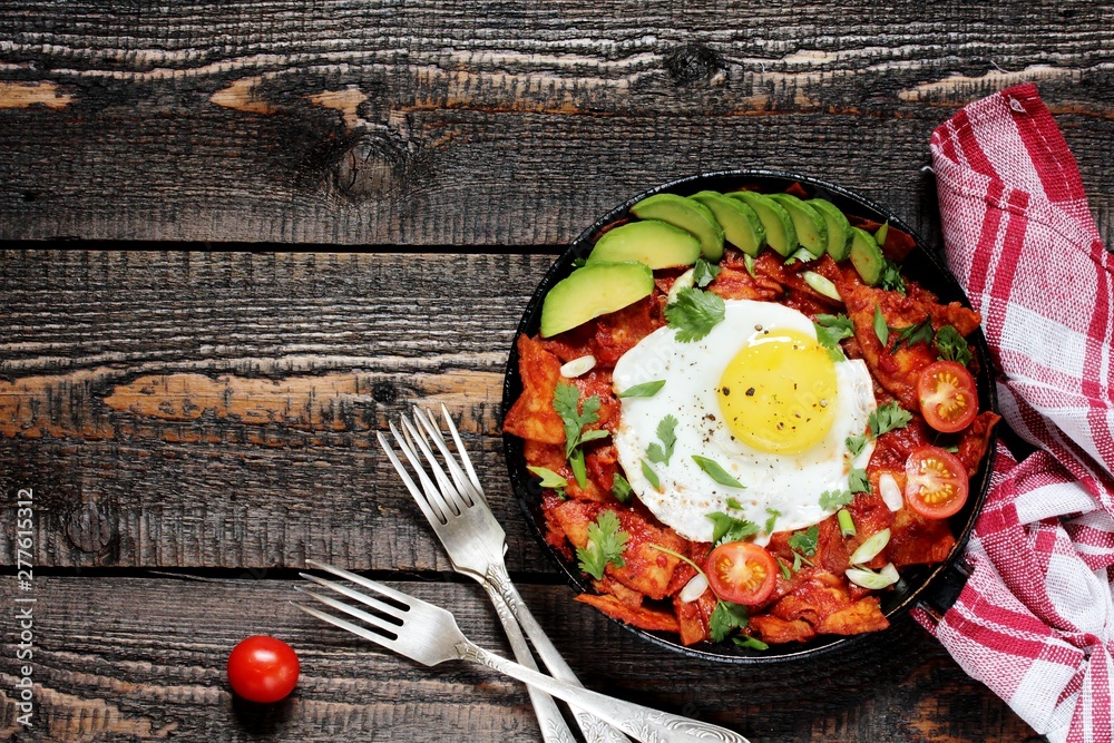 mexican breakfast Chilaquiles . tortilla chips are lightly stewed in a