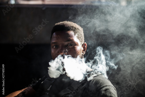 Afro man smoke