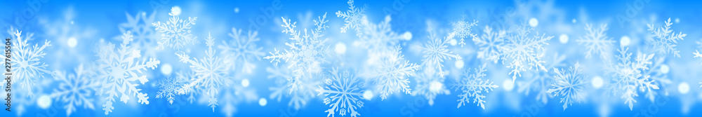 Christmas banner of complex blurred and clear snowflakes in white colors on light blue background. With horizontal repetition Christmas banner of complex blurred and clear snowflakes in white colors on light blue background. With horizontal repetition