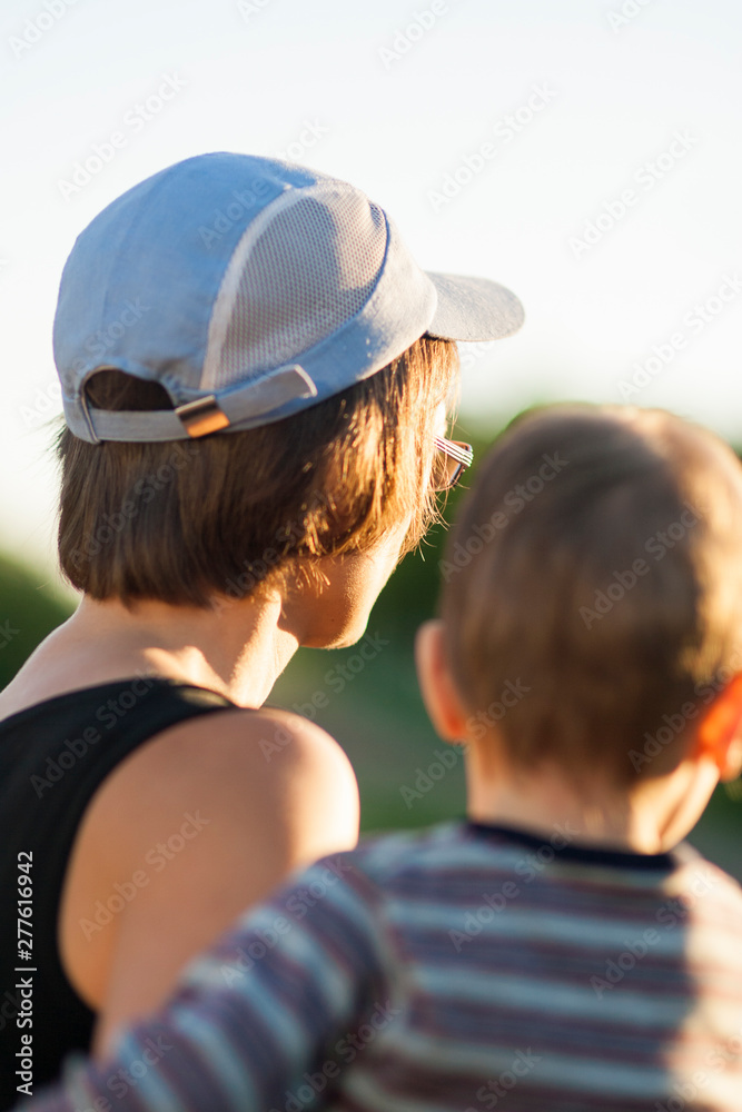 Back View of Mother and Her son Watching Forward. Back View of Mother and Her son Watching Forward.