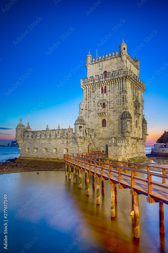 Famous Ancient Belem Tower on Tagus River in Lisbon at Blue Hour in Portugal.
