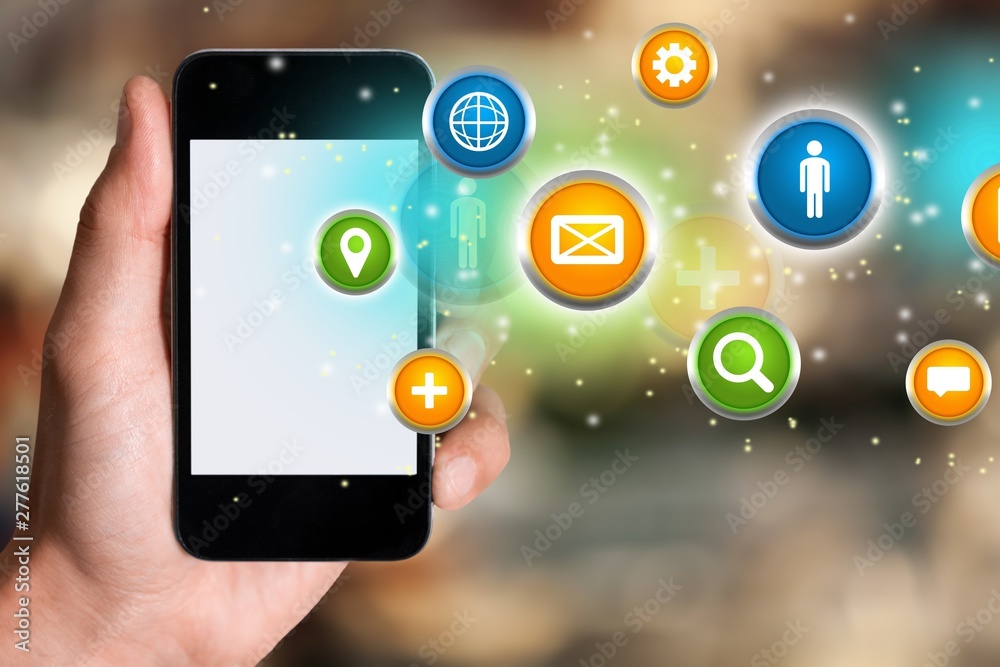 Hand holding the smartphone with colorful icons Hand holding the smartphone with colorful icons