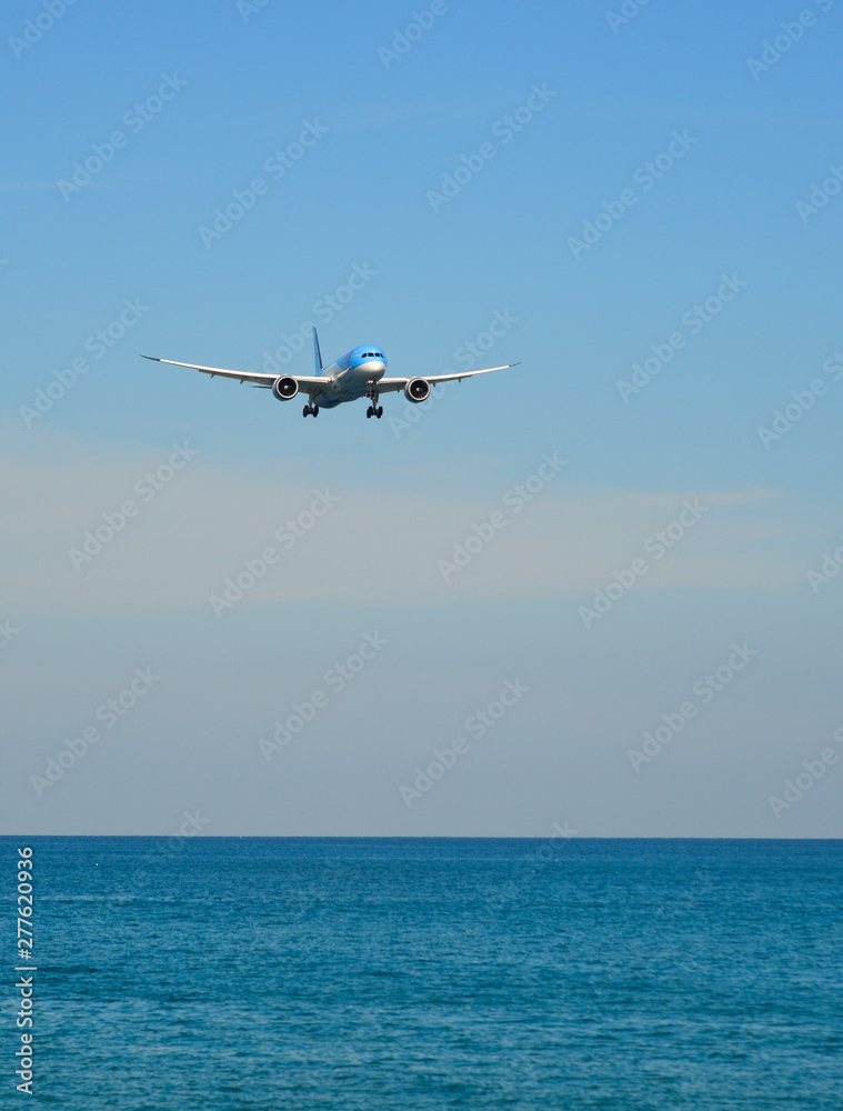 Airplane landing at Phuket Airport (Thailand)