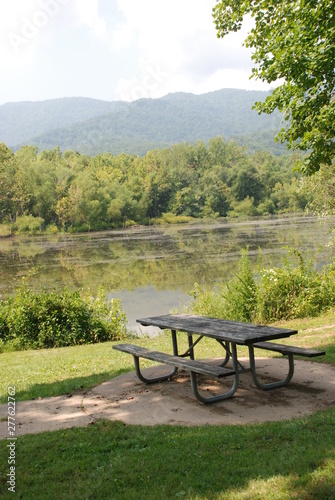 picnic table by water