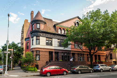 Clinton Hill, Brooklyn, United States - June 30, 2019: Historic brownstone building on beautiful summer evening in Clinton Hill, Brooklyn, New York.