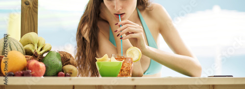 Attractive young woman havi...