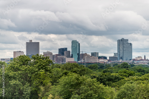 Fort Worth city in Texas with green trees in park and cityscape skyline and cloudy day © Kristina Blokhin