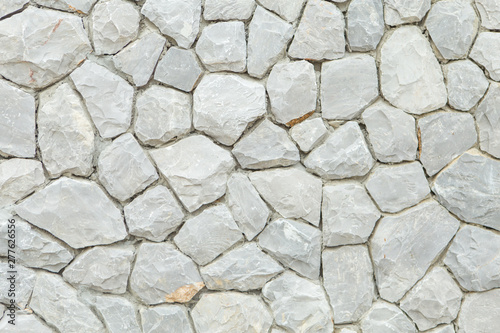 White brick wall  Arranged in small chunks  Used as a background image