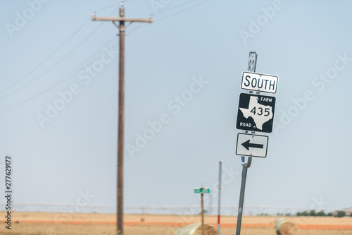 Plains, USA Texas countryside industrial town road and sign for south 435 historic farm road direction arrow view from 380 highway