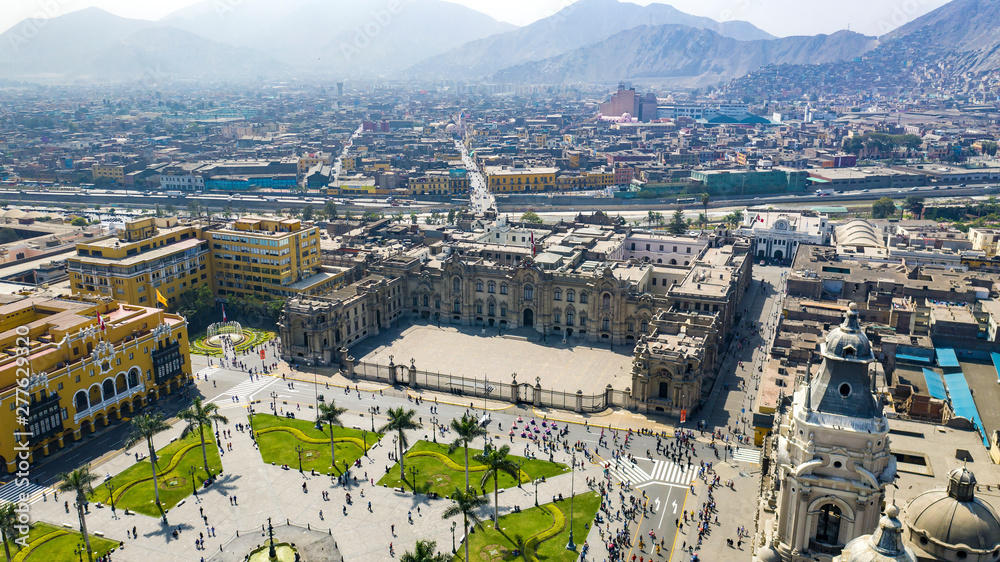 Aerial view of Lima main square, government palace of Peru and cathedral church. Tourists and people gathered at 