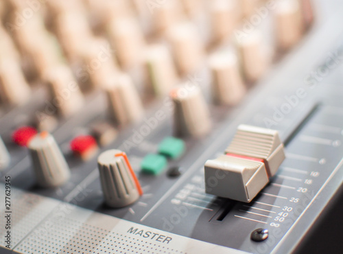 Sound equalizer mixing. Professional studio equipment for sound mixing. Music studio image. Close up and selective focus. photo