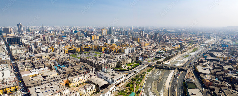 Aerial view of Lima main square, government palace of Peru and Rimac river. Panoramic cityscape with 
