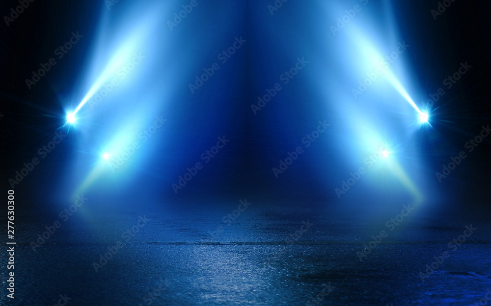 Empty background scene. Dark street reflection on wet asphalt. Rays of neon light in the dark, neon figures, smoke. Background of empty stage show. Abstract dark background.