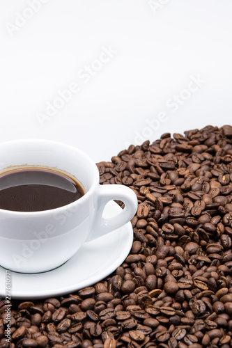 white cup of coffee with coffee bean on white background 