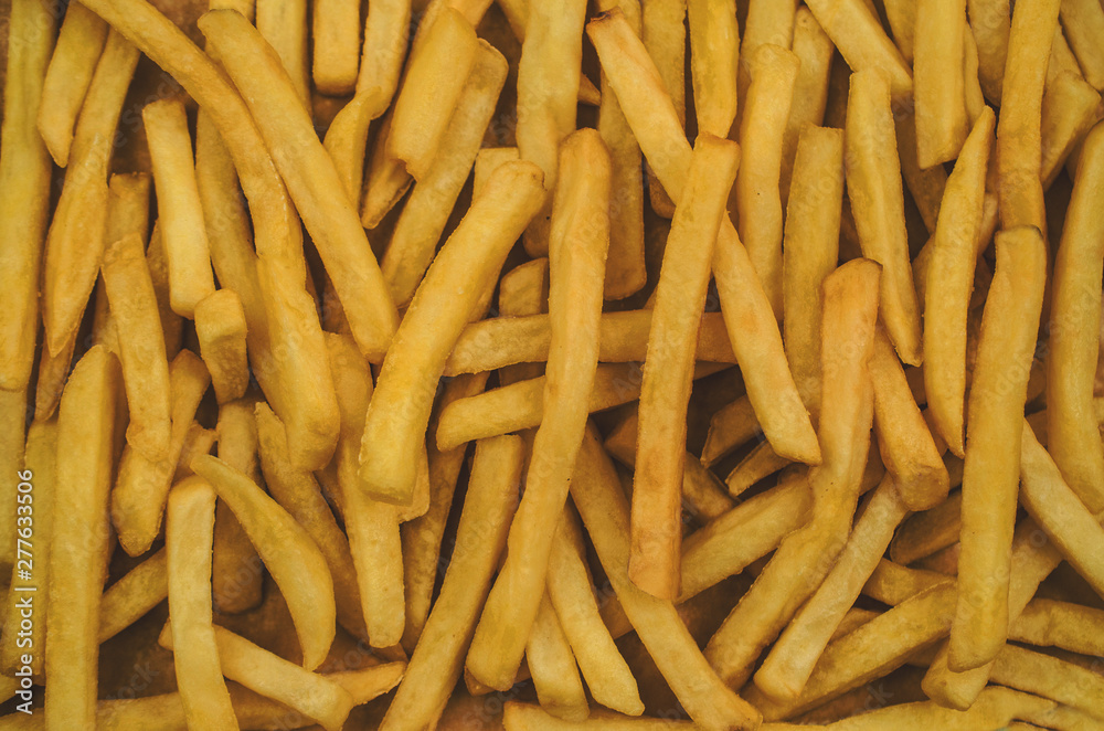 Crispy french fries texture background Crispy french fries texture background