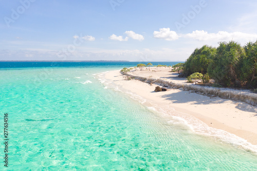 Fototapeta Naklejka Na Ścianę i Meble -  Large tropical island white sandy beach, view from above. Seascape, nature of the Philippine Islands. Tropical forest and sea lagoons.